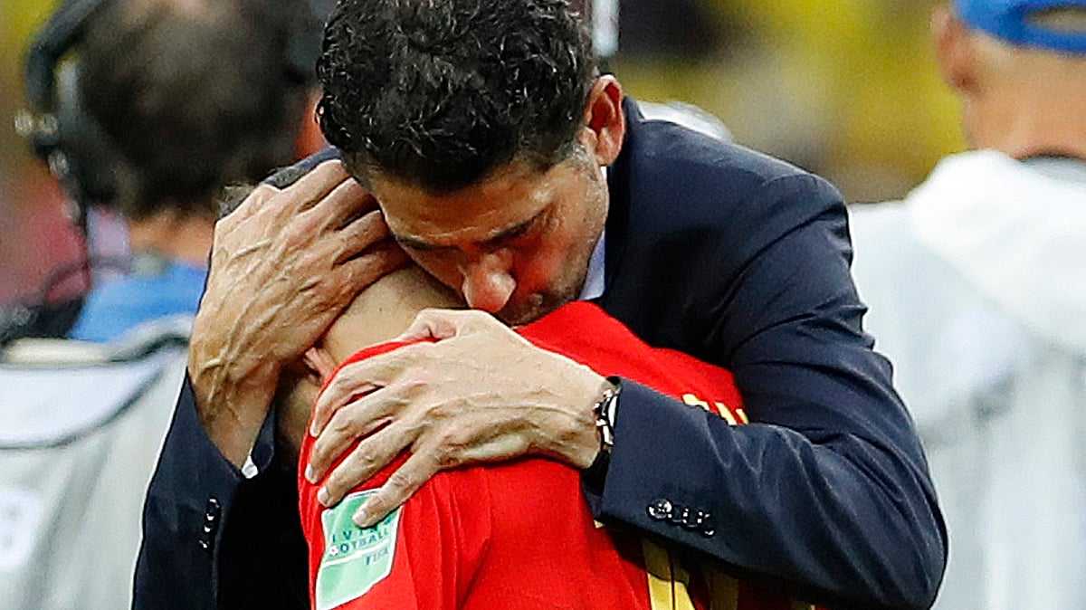 Spain head coach Fernando Hierro comforts Spain’s Nacho Monreal after his team lost by penalty shootout during the round of 16 match between Spain and Russia at the 2018 soccer World Cup at the Luzhniki Stadium in Moscow