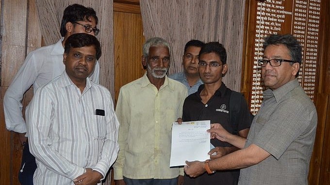 Asharam Choudhary (second from right) with father Ranjit (second from left).