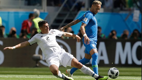 Johnny Acosta (left) vies with Neymar for the ball at the FIFA World Cup in Russia. He will now play at East Bengal