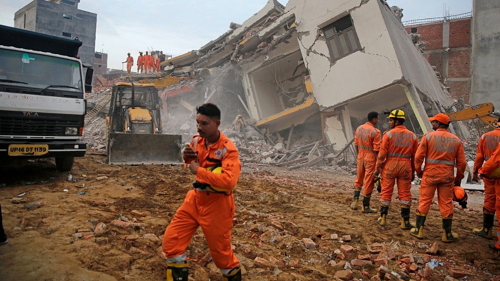 A six-storey building fell on an adjacent four-storey building on late Tuesday evening in Greater Noida’s Shah Beri village.