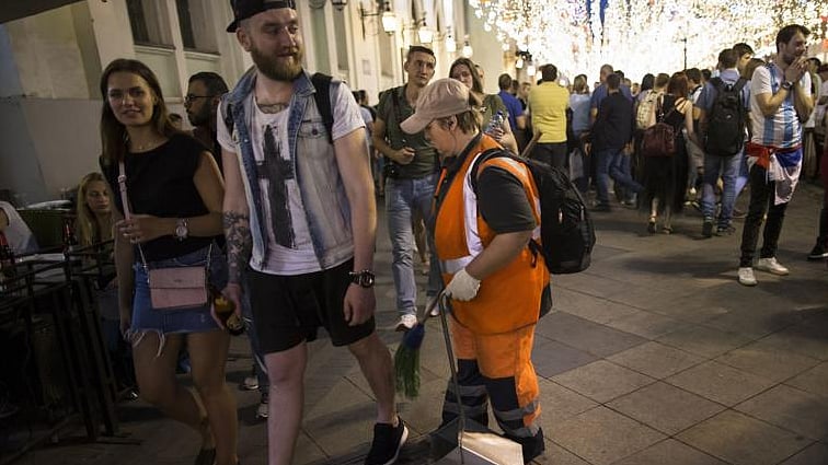 Migrant workers, often unobserved, have become the backbone of building stadiums and sustaining tourists during the World Cup
