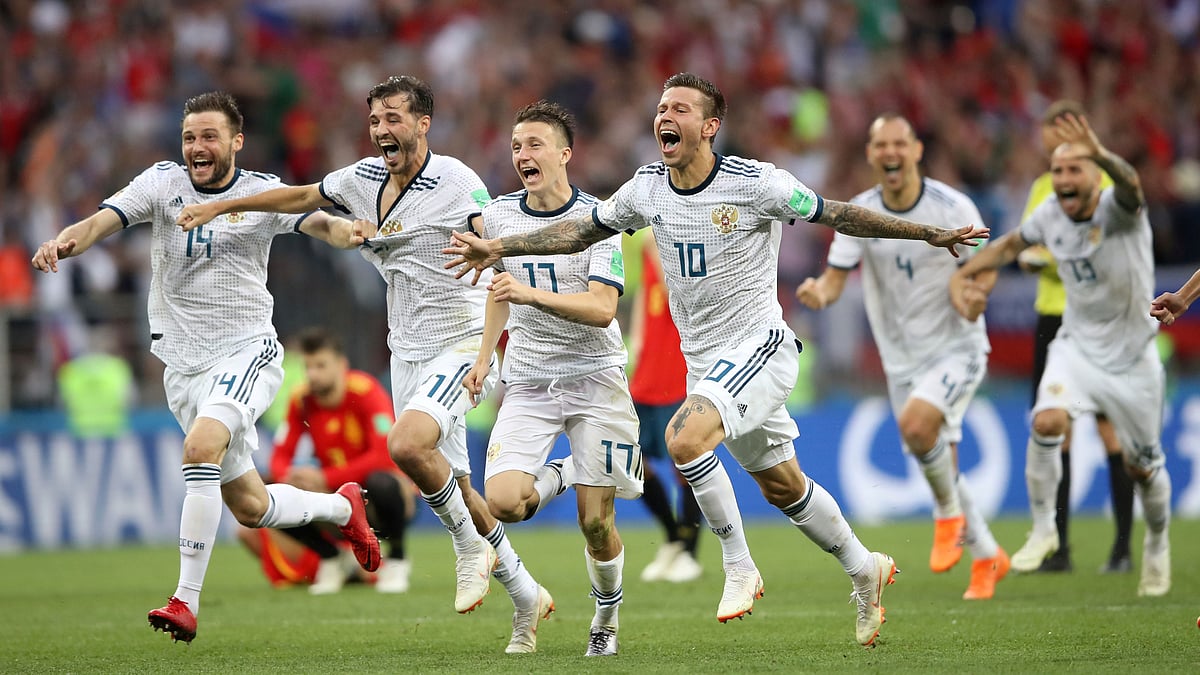 Russia players celebrate after winning the penalty shootout against Spain in the Round of 16 of the FIFA World Cup.