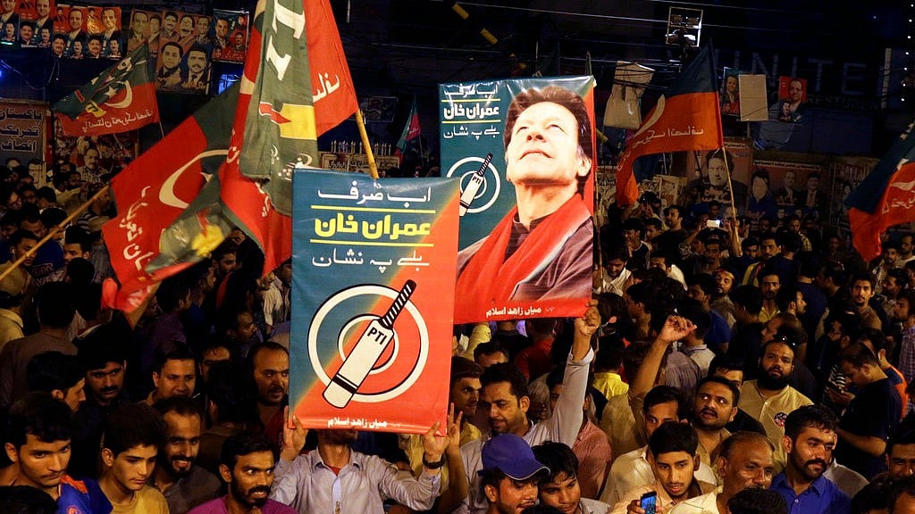 Supporters of Pakistani politician Imran Khan, chief of Pakistan Tehreek-e-Insaf party, celebrate projected unofficial results announced by television channels indicating their candidates’ success in the parliamentary elections in Islamabad, Pakistan, Wednesday, July 25, 2018.