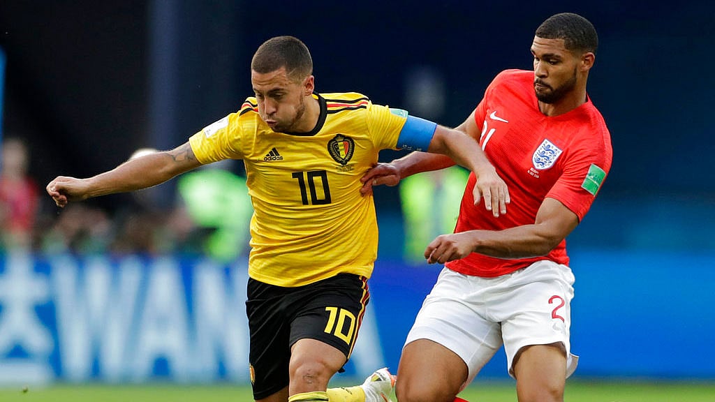 Belgium’s Eden Hazard, left, battles for the ball with England’s Ruben Loftus-Cheek.