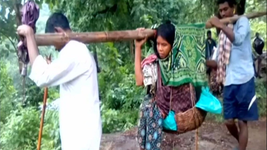 A pregnant woman had to be carried 12 kms in a makeshift basket to reach an ambulance.