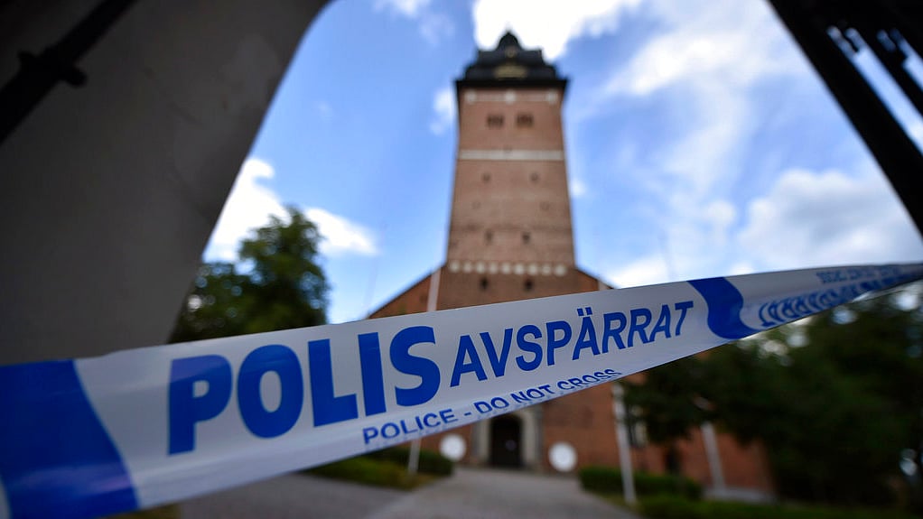 In this Tuesday, 31 July, 2018 photo, a police cordon near the scene of a robbery at the Strangnas Cathedral, in Strangnas, Sweden. 