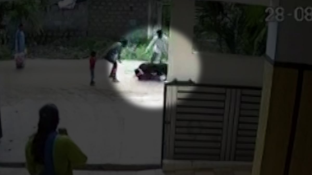 Locals trying to rescue Sushanth as the dogs maul him