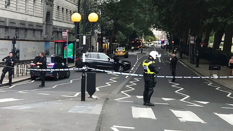 Armed police swooped into the area and cordoned off streets surrounding the heart of Britain’s government. 