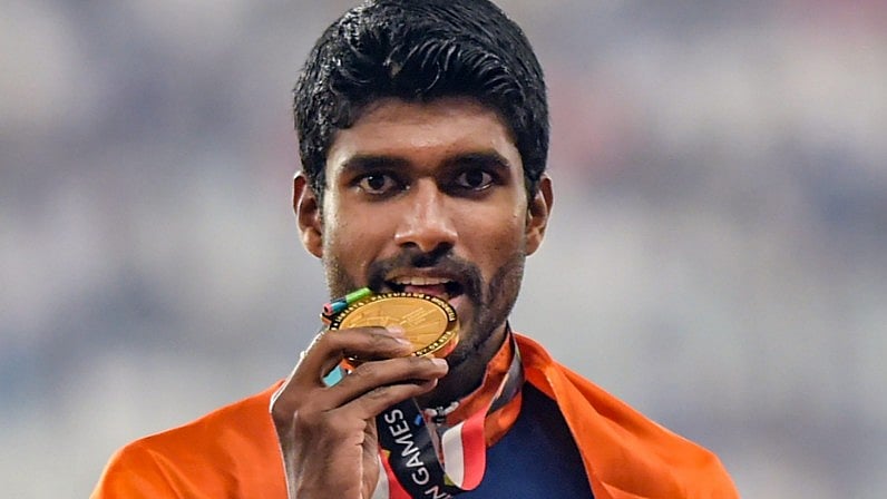 Jinson Johnson celebrates after his gold in the men’s 1500m.&nbsp;