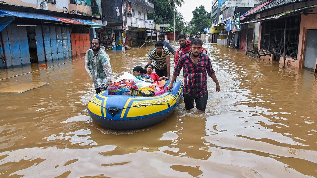 People being rescued from flood-affected regions following heavy monsoon rainfall, in Kochi on Saturday, 18 August, 2018. 