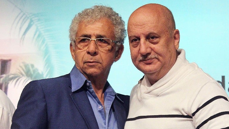 Naseeruddin Shah with Anupam Kher at an event.