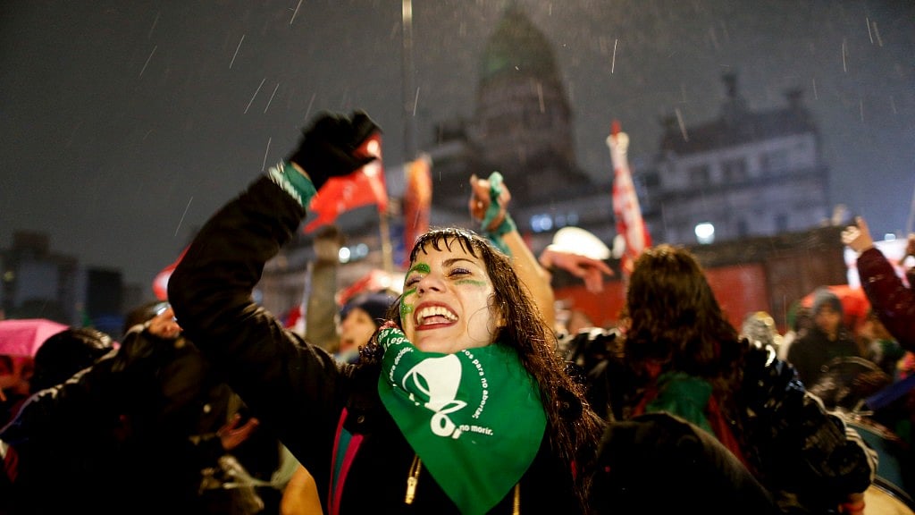 Women in support of decriminalizing abortion protested in the rain. 