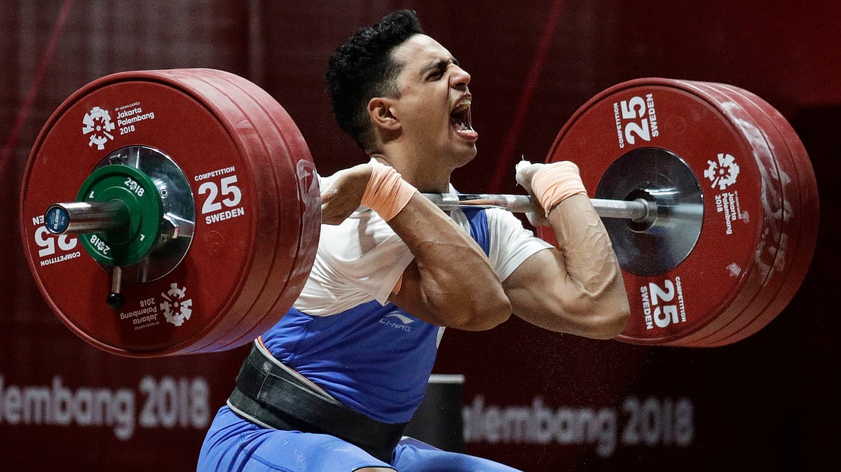 India’s Ajay Singh reacts during the men’s 77kg weightlifting at the 18th Asian Games in Jakarta, Indonesia, Thursday, Aug. 23, 2018. 