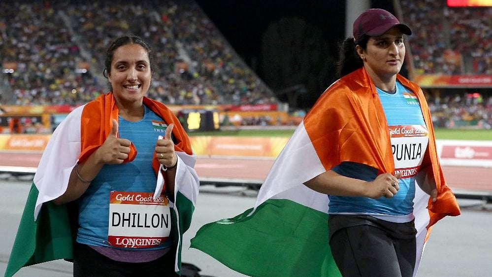 File photo of Seema Punia (R) celebrating her silver medal in CWG 2018.