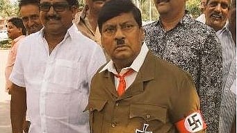 TDP MP Naramalli Sivaprasad dressed up as Adolf Hitler outside parliament.