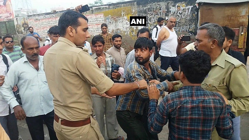 Two Muslim youths were allegedly thrashed and paraded by a mob led by the head of a vigilante group on suspicion of smuggling two cows in UP. 