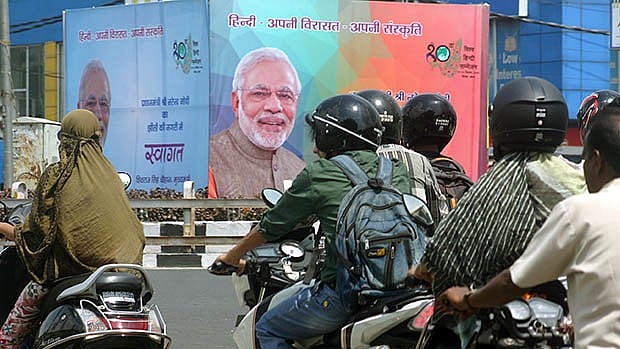 Vehicles pass by a government of India poster around the World Hindi Conference in September, 2015. Image used for representational purpose.