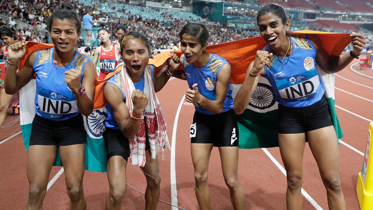 India’s 4x400m relay team celebrate after winning the gold medal during the athletics competition at the 18th Asian Games.