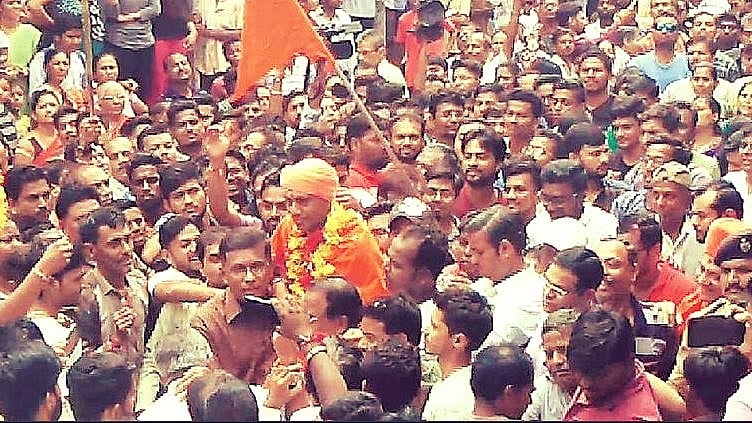 Former RSS worker Bhavesh Patel, clad in saffron clothes, came home to a hero’s welcome.