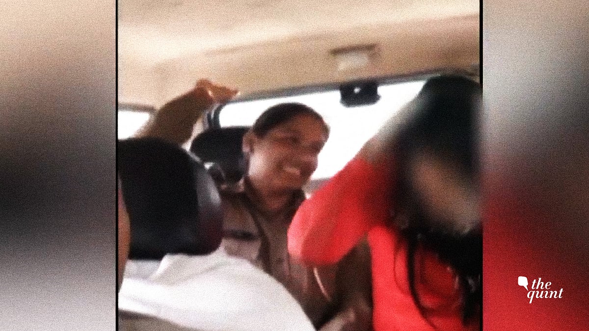 A female cop is seen hitting the woman and also subsequently, on the instructions of the male cop, yanking the woman’s scarf forcefully off her face.