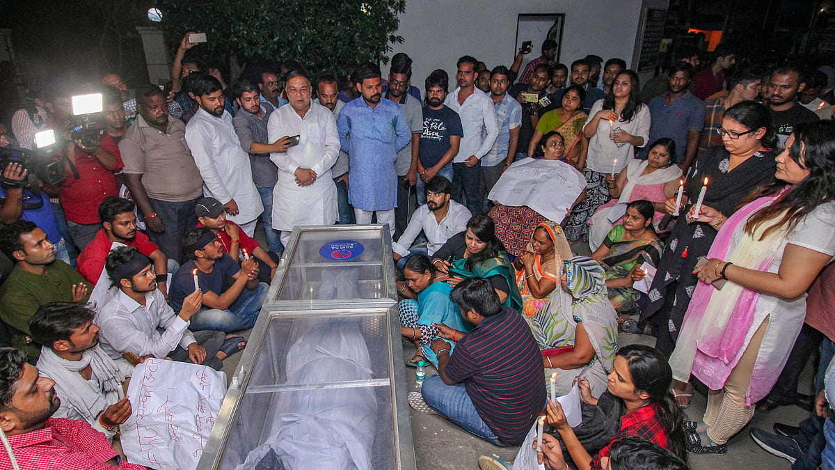 Samajwadi Party workers and family members of Vivek Tiwari, who was shot by a police constable on patrol duty, mourns his death, and showing protest by light the candles in Lucknow