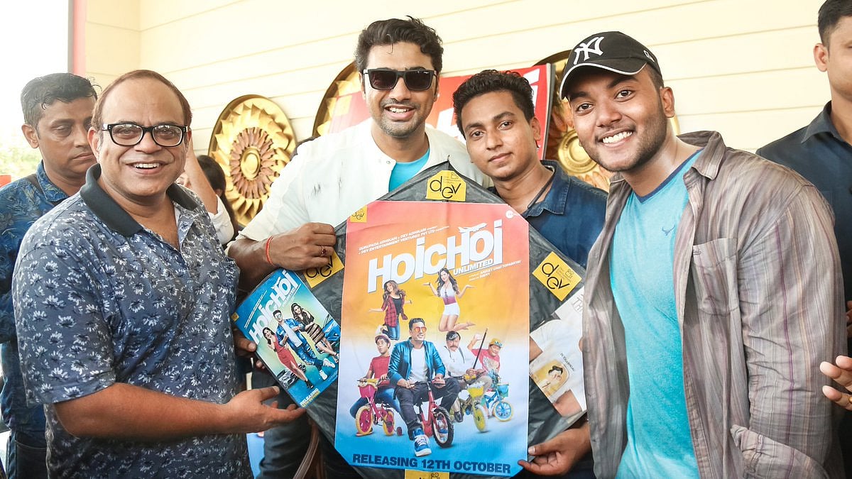 TMC MP Deepak Adhikari, popularly known as Dev, holding the banner of his upcoming movie, ‘Hoichoi Unlimited’.