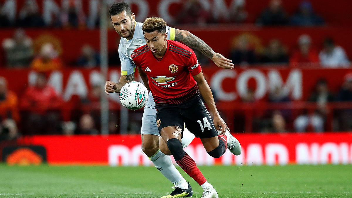 Derby County’s Bradley Johnson, behind, runs after Manchester United’s Jesse Lingard, during the English League Cup.