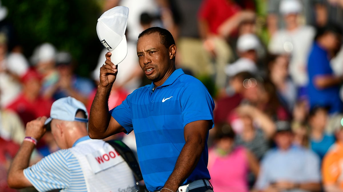 Tiger Woods finishes the 18th hole maintaining the lead at 12 under par during the third round of the Tour Championship golf tournament Saturday, Sept. 22, 2018, in Atlanta. 