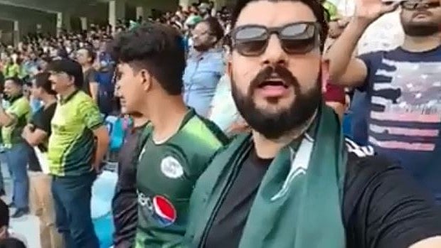 A Pakistani cricket fan is seen singing the Indian national anthem. 