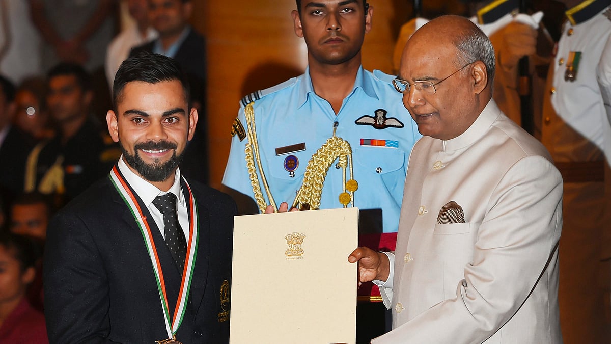President Ram Nath Kovind confers Rajiv Gandhi Khel Ratna award on cricketer Virat Kohli at the National Sports and Adventure Award 2018 function at Rashtrapati Bhawan in New Delhi.