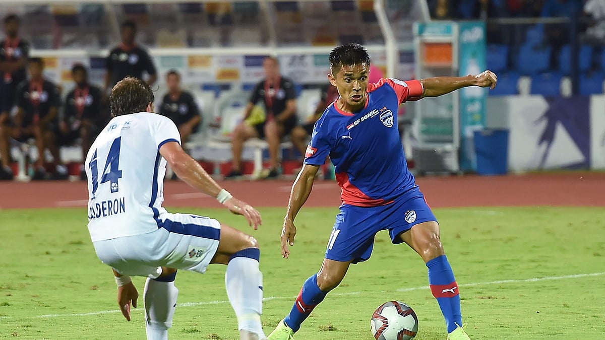 Bengaluru FCs Sunil Chhetri and Chennaiyin FCs Calderon vie for the ball during the ISL 2018 at Kanteerava stadium in Bengaluru.