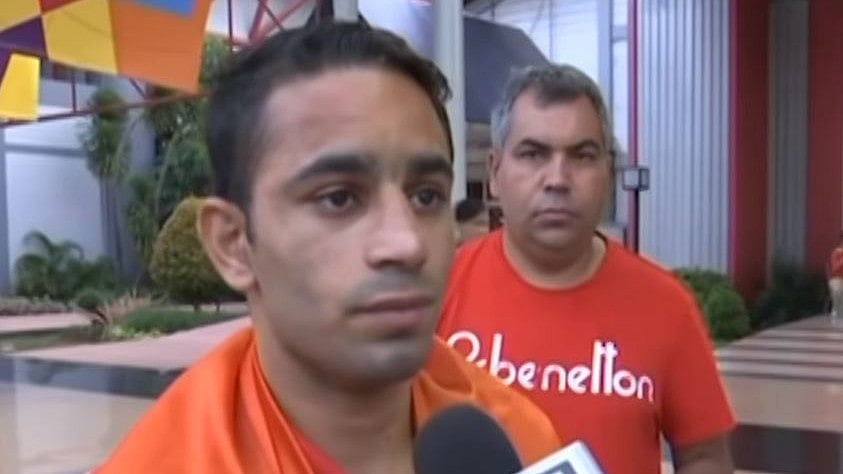 Boxer Amit Panghal speaks to the media after winning a gold at the Asian Games.