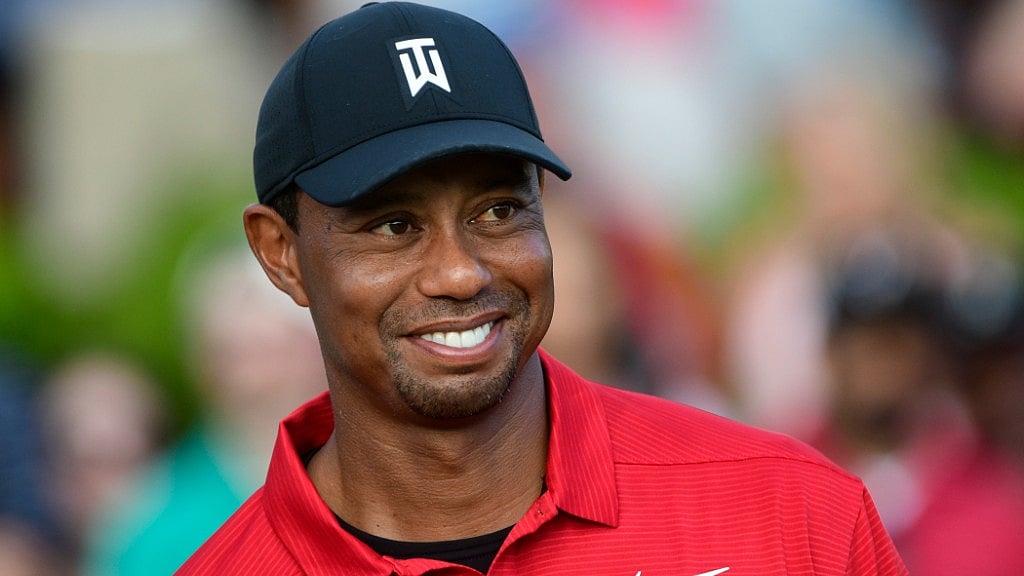 Tiger Woods stands on the 18th green after winning the Tour Championship golf tournament on Sunday in Atlanta.