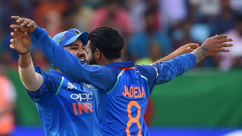 Indian skipper Rohit Sharma and Ravindra Jadeja celebrate the fall of a Bangladeshi wicket on Friday. 