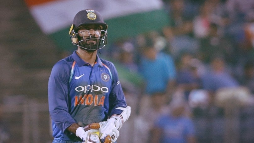 Dinesh Karthik walks back to the pavilion after being dismissed in an ODI.
