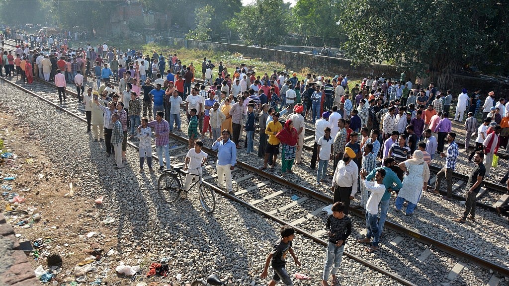 A crowd at the site of the train accident in Amritsar.