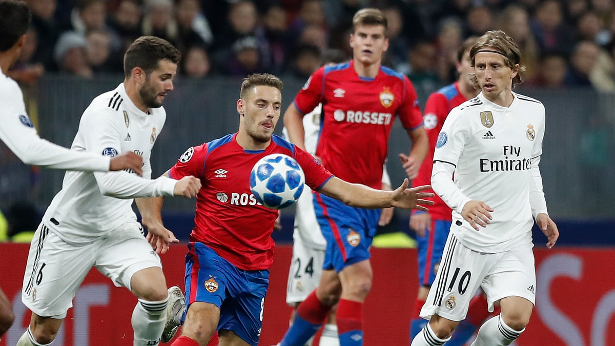 CSKA midfielder Nikola Vlasic, center, challenge for the ball with Real midfielder Luka Modric, right, and Real defender Nacho Fernandez during a Group G Champions League soccer match. 