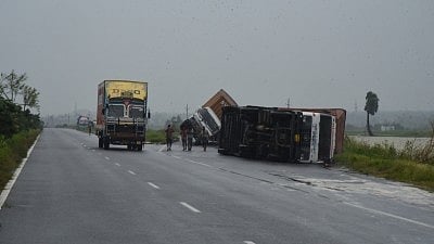 Srikakulam: Trucks lay overturned at a street after severe cyclonic storm Titli wrecked havoc in Srikakulam district of Andhra Pradesh on October 11, 2018. 