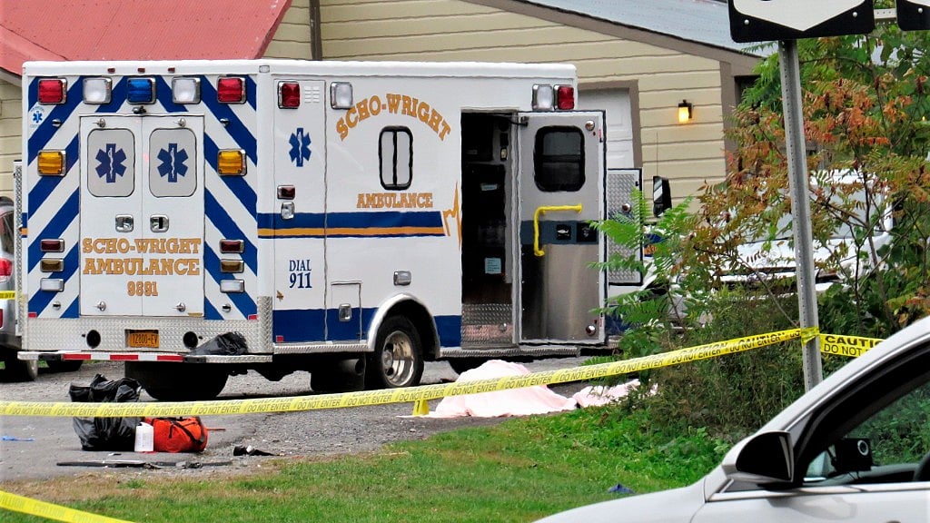  A body is draped under a blanket at the scene of a fatal crash in Schoharie, New York.&nbsp;