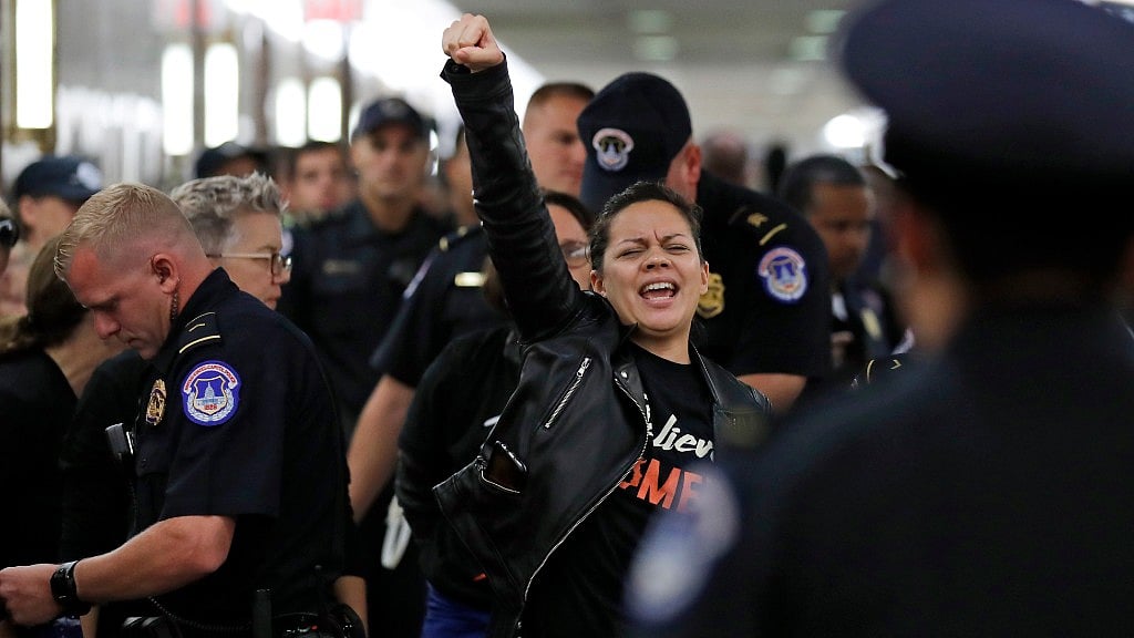 A protester is arrested by Capitol Hill Police during the Kavanaugh nomination. 
