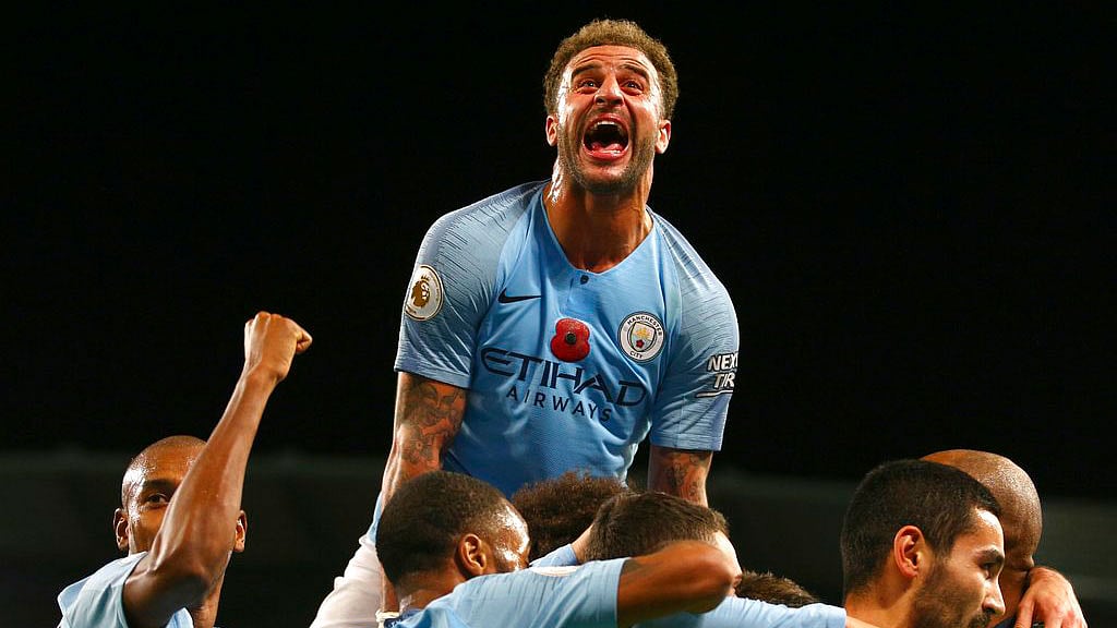 Manchester City’s Kyle Walker, top, celebrates after Ilkay Gundogan scored his side’s third goal against Manchester United.