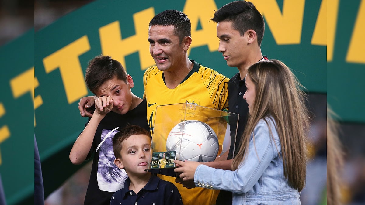 Australia’s Tim Cahill, center, celebrates with his children, Kyah, second right, Shae, left, Sienna, right, and Cruz, after playing his final game for Australia.