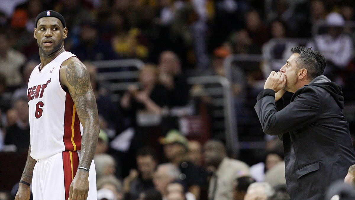  In this Thursday, Dec. 2, 2010, file photo, a Cleveland Cavaliers fan yells at Miami Heat forward LeBron James (6) during the first quarter of an NBA basketball game in Cleveland.