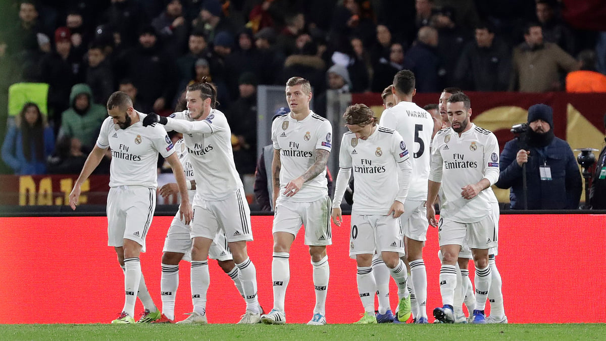 Real Madrid players celebrate during their 2-0 win vs AS Roma in the UEFA Champions League.