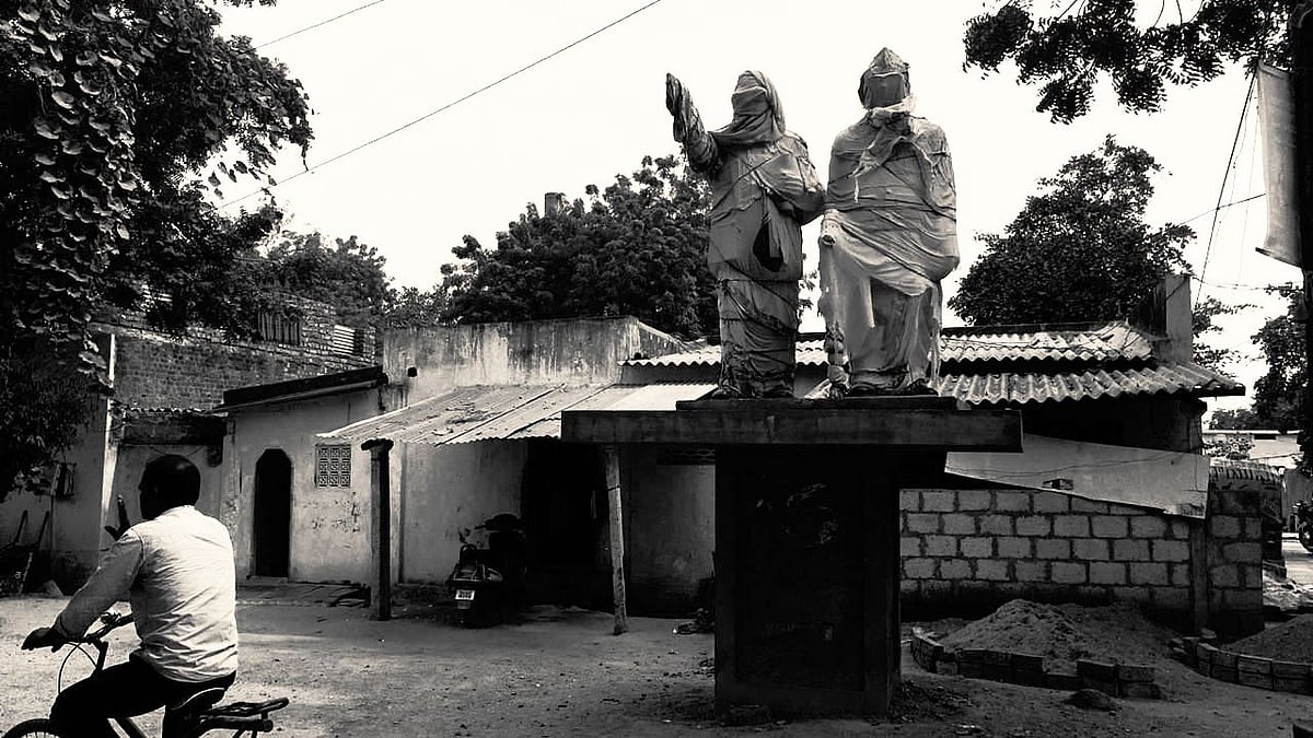 Statues of BR Ambedkar and B Babu Jagjivaram covered with cloths ahead of election in Nalgonda district in Telangana. 