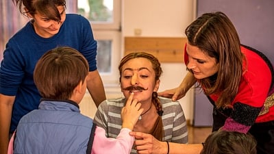 Actress Stana Katic at an orphanage in Bulgaria with members of the Absentia crew