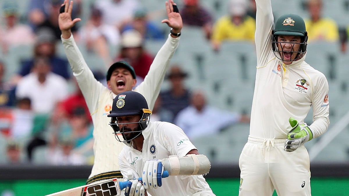 Australian captain Tim Paine (right) appeals for the wicket of Murali Vijay (center) during the first Test vs India at Adelaide.