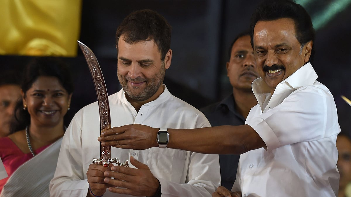 Congress President Rahul Gandhi is being presented a sword by DMK President MK Stalin at a public meeting after unveiling a life-size bronze statue of late Chief Minister and DMK President M Karunanidhi at YMCA ground.