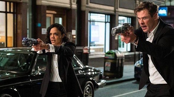 Tessa Thompson and Chris Hemsworth as secret agents in <i>Men in Black International.</i>