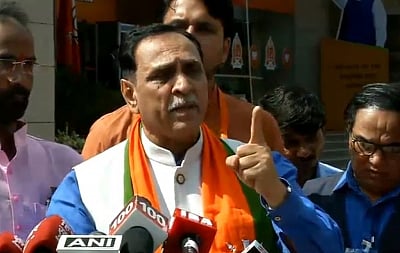 New Delhi: Gujarat Chief Minister and BJP leader Vijay Rupani addresses a press conference, in New Delhi on Sept 9, 2018. (Photo: IANS/BJP)